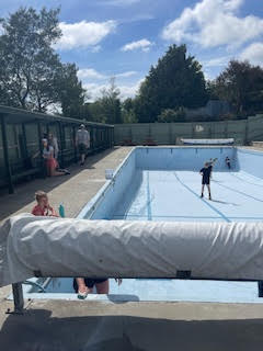 Community volunteers at the pool during a working bee