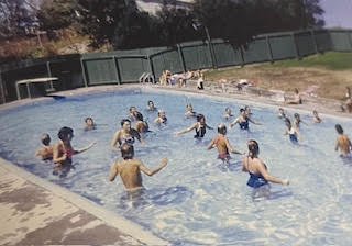 Vintage photo of the community enjoying the Cust pool